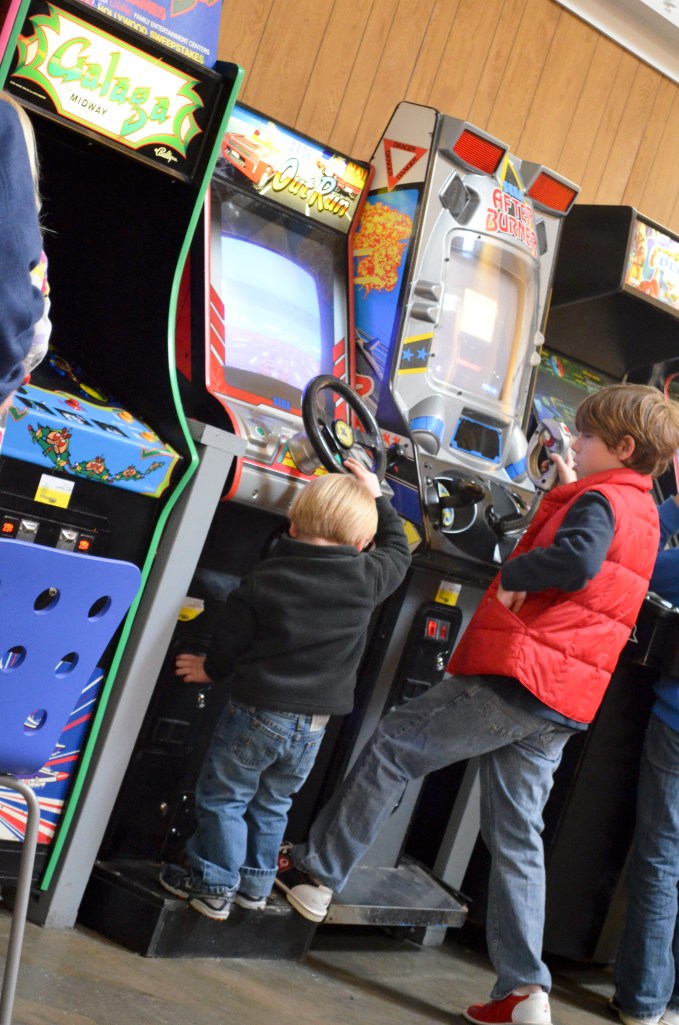 "I get by with a little help from my friends."  (We don't know this kid but he was so kind to help little Wyatt figure the game out.)