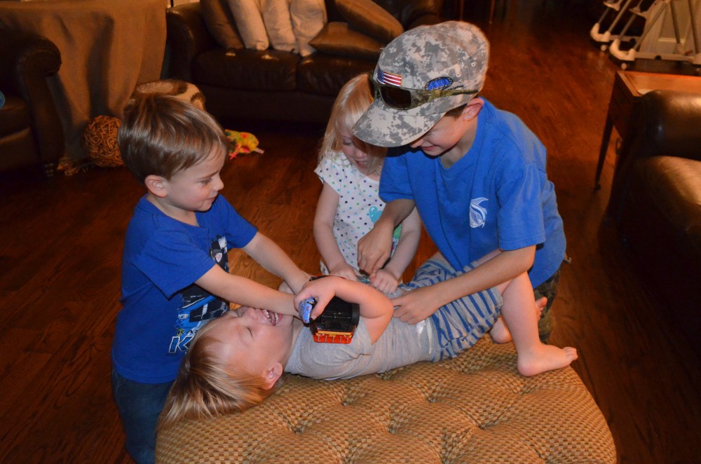 Don't be fooled.  This boy does not get pinned down unless he allows it!  The Elsey boys and his sister gave him a good tickle session!