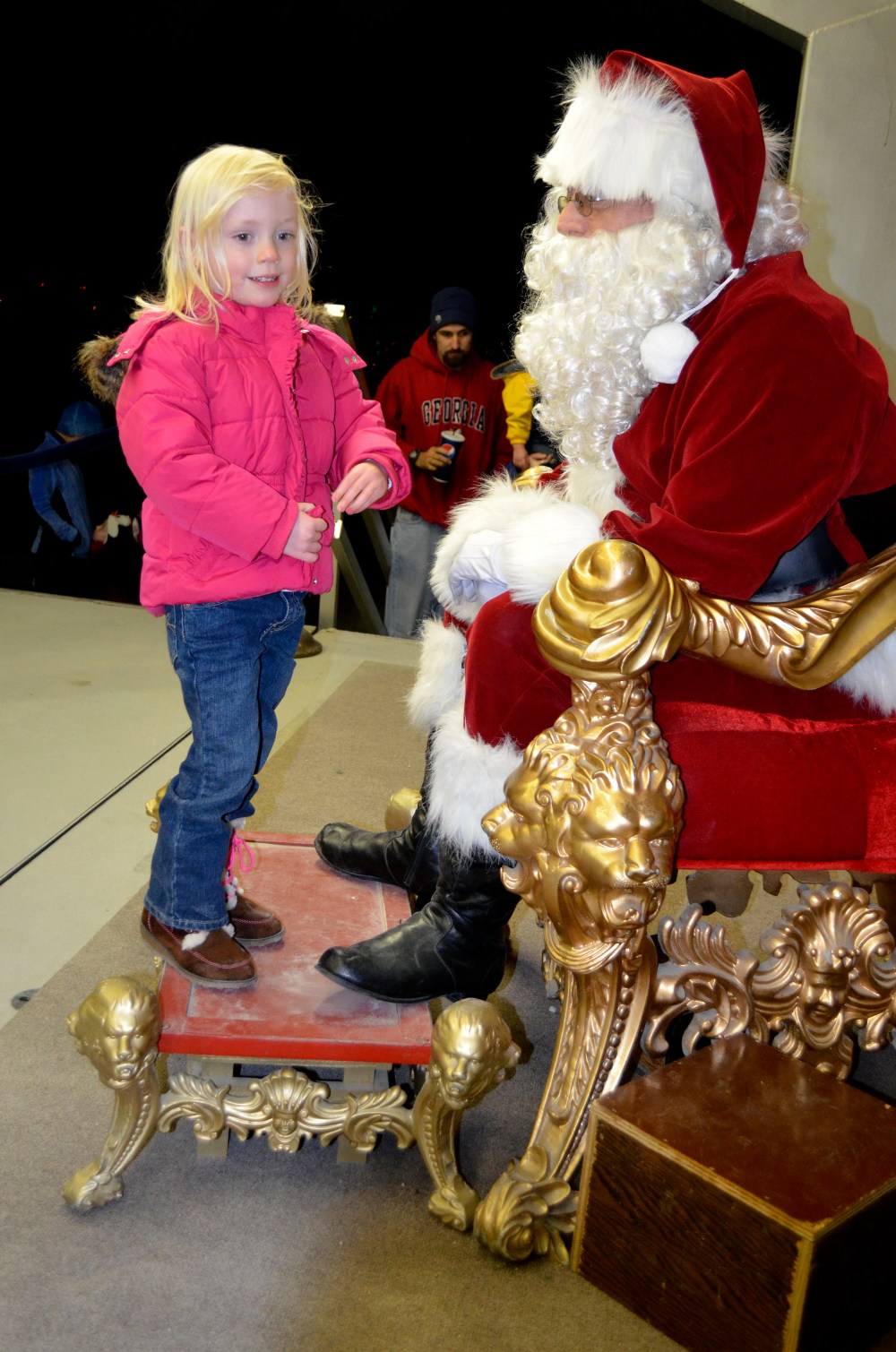 Ever cautious, Heidi made sure not to stand too close or look Santa in the eye.  ;)