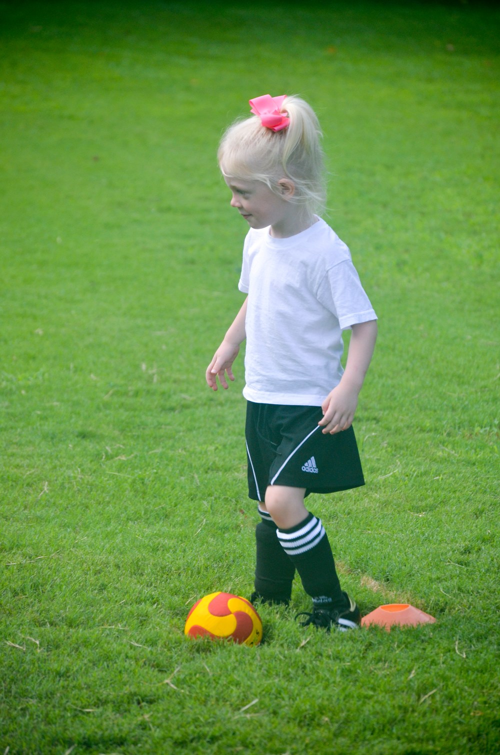 1st day of soccer.  See that grin?  She is so happy but trying to be cool.