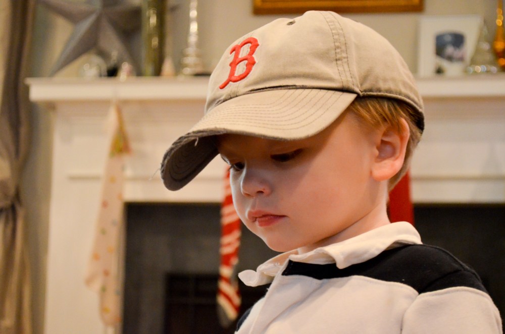 A Boston fan in the making? Moose nearly didn't get his hat back.