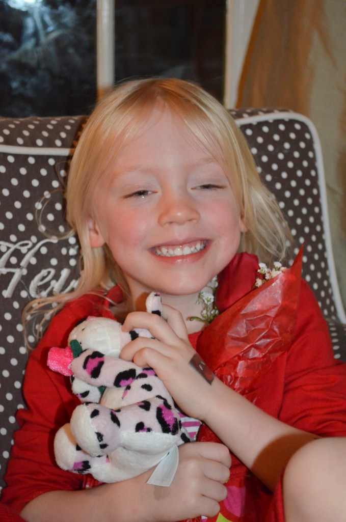 Heidi felt very special when Uncle David gave her a little stuffed animal and rose.