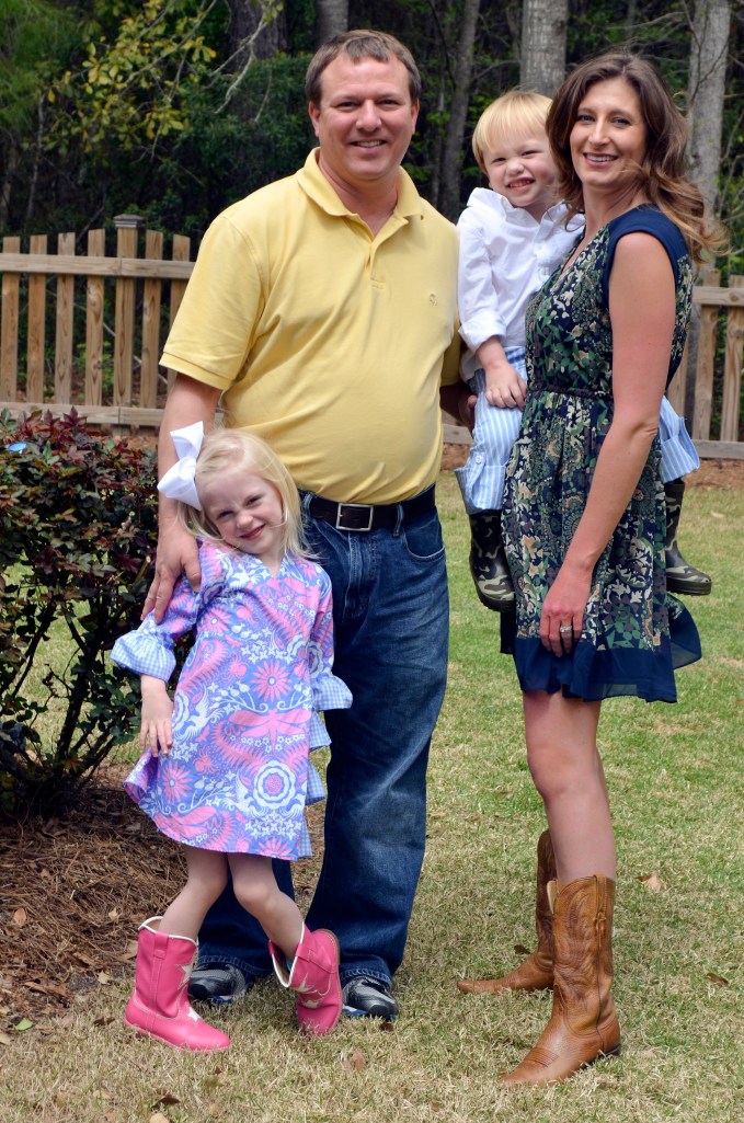 Family pic.  We do this every Easter.  I put the camera on the fence post, get everything just right, push delay and run like crazy to pose in the shot!  It only took 5 tries this year!
