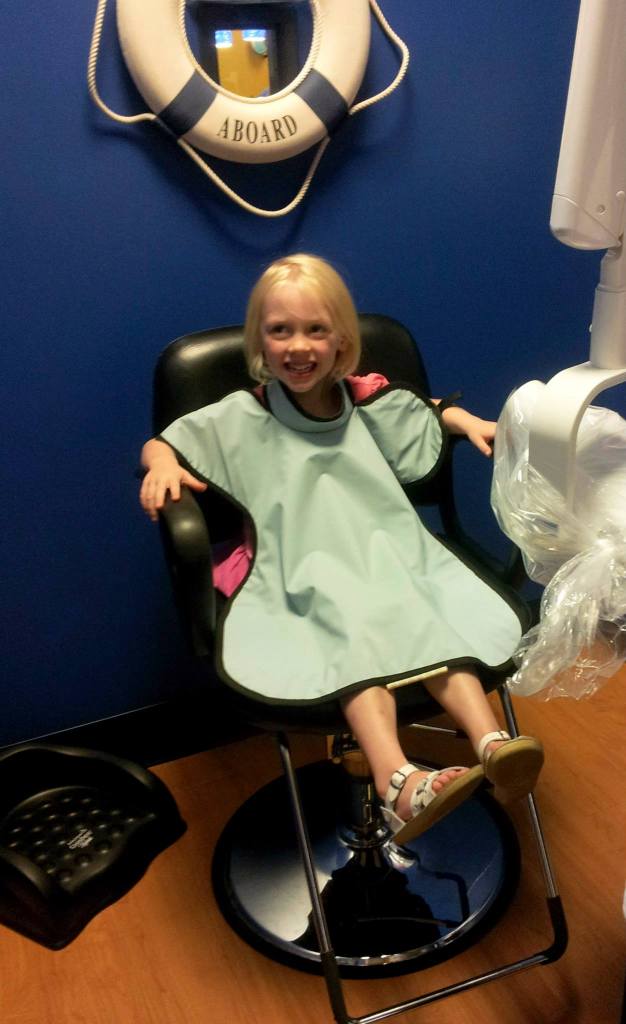 Heidi loves having her teeth cleaned at Kids Teeth! She's watching the action while her fluoride is applied!